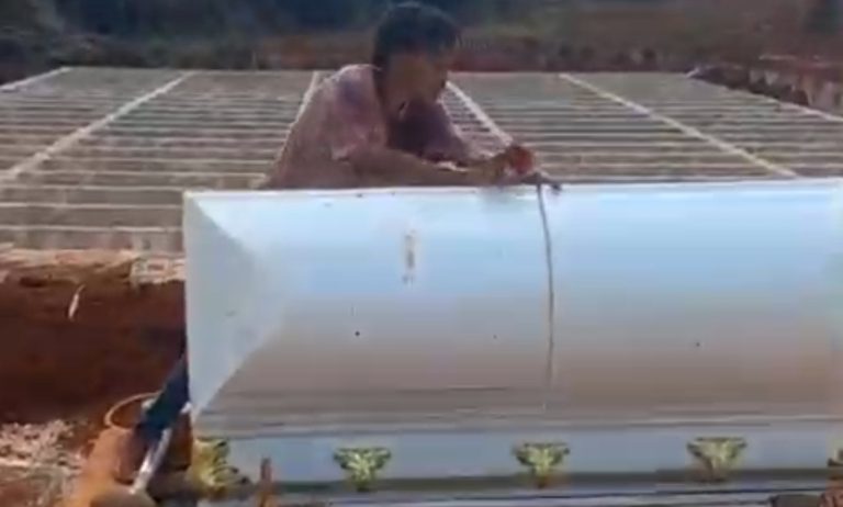 Man throws woman out of casket, shot by mourner